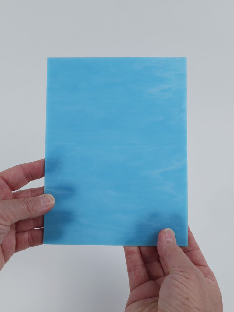 Video of the Pale Opal Turquoise glass plate in translucent turquoise, 15x19cm, held up and tilted to show its pattern and transparency