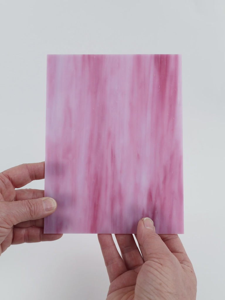 Video of the Pink Purple glass plate in translucent pink, 15x19cm, held up and tilted to show its pattern and transparency