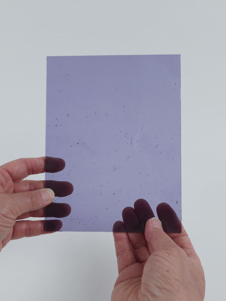 Video of the Pale Grape glass plate in transparent purple, 15x19cm, held up and tilted to show its pattern and transparency