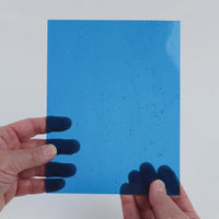 Video of the Turquoise glass plate in transparent turquoise, 15x19cm, held up and tilted to show its pattern and transparency