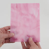 Video of the Sugar Plum glass plate in translucent pink, 15x19cm, held up and tilted to show its pattern and transparency