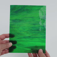 Video of the Mystic glass plate in translucent green-teal-blue, 15x19cm, held up and tilted to show its pattern and transparency